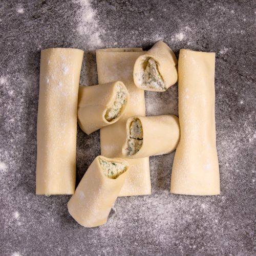 Fresh cannelloni on floured bench