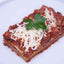 Mediterranean Roast Vegetable Lasagna made fresh on a plate with cheese on top