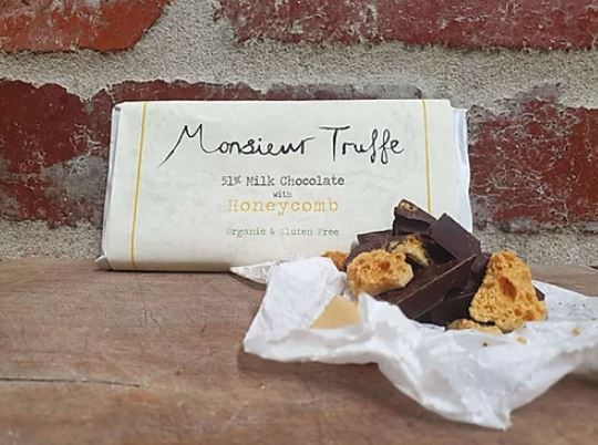 honeycomb chocolate placed in front of bricks