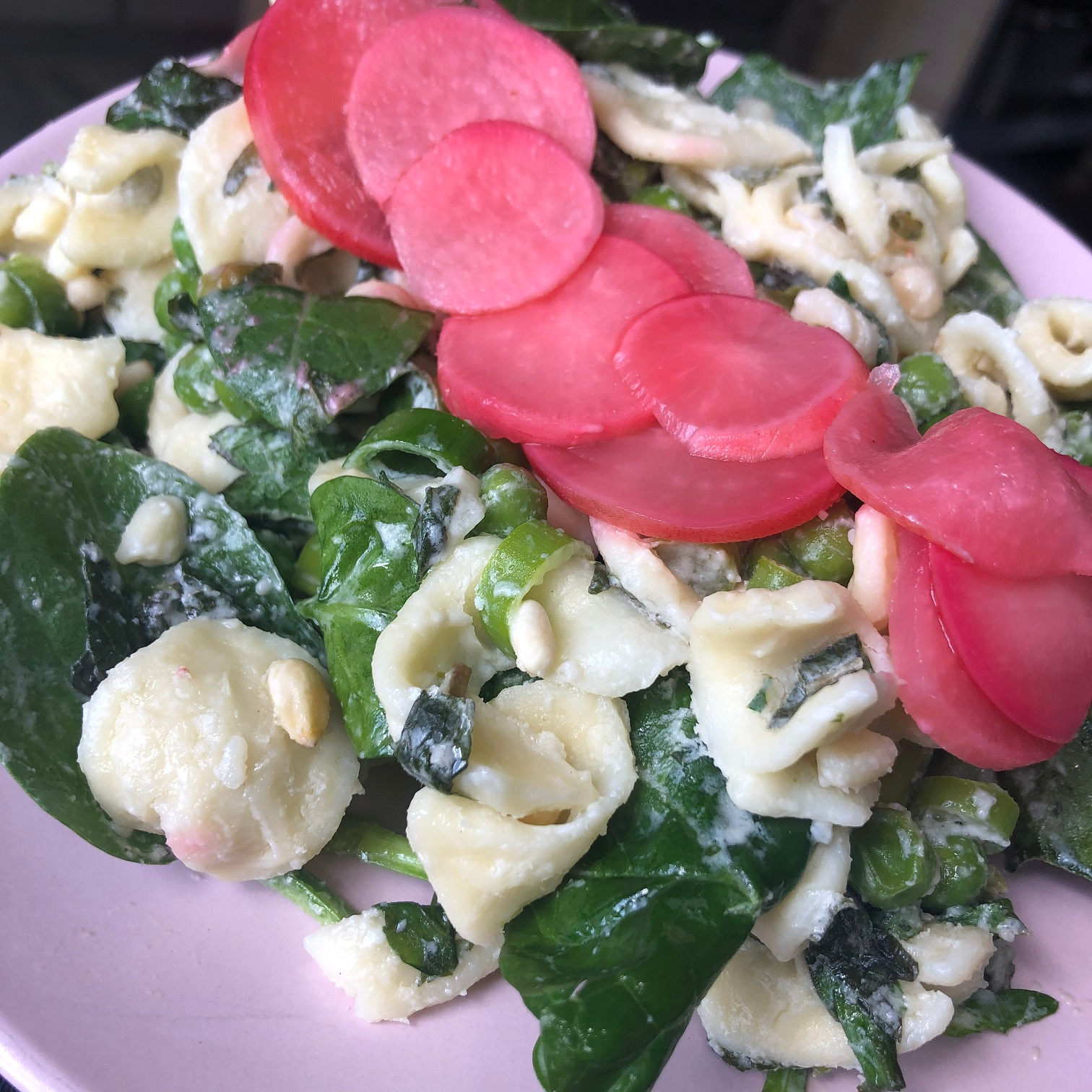 pasta salad with spinach plated
