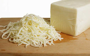 Shredded mozzarella cheese on board